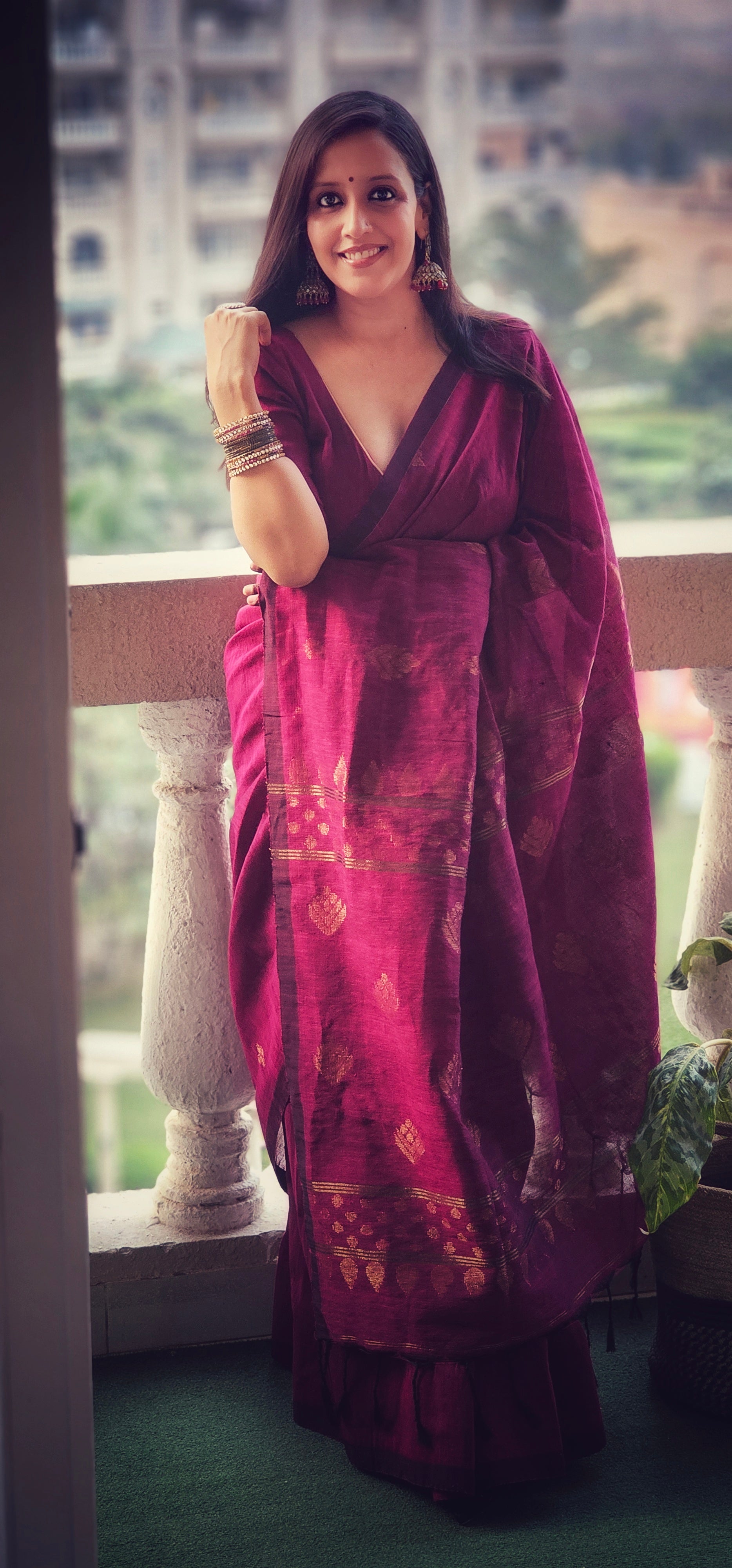 Wine pure handwoven linen saree with zari booti design