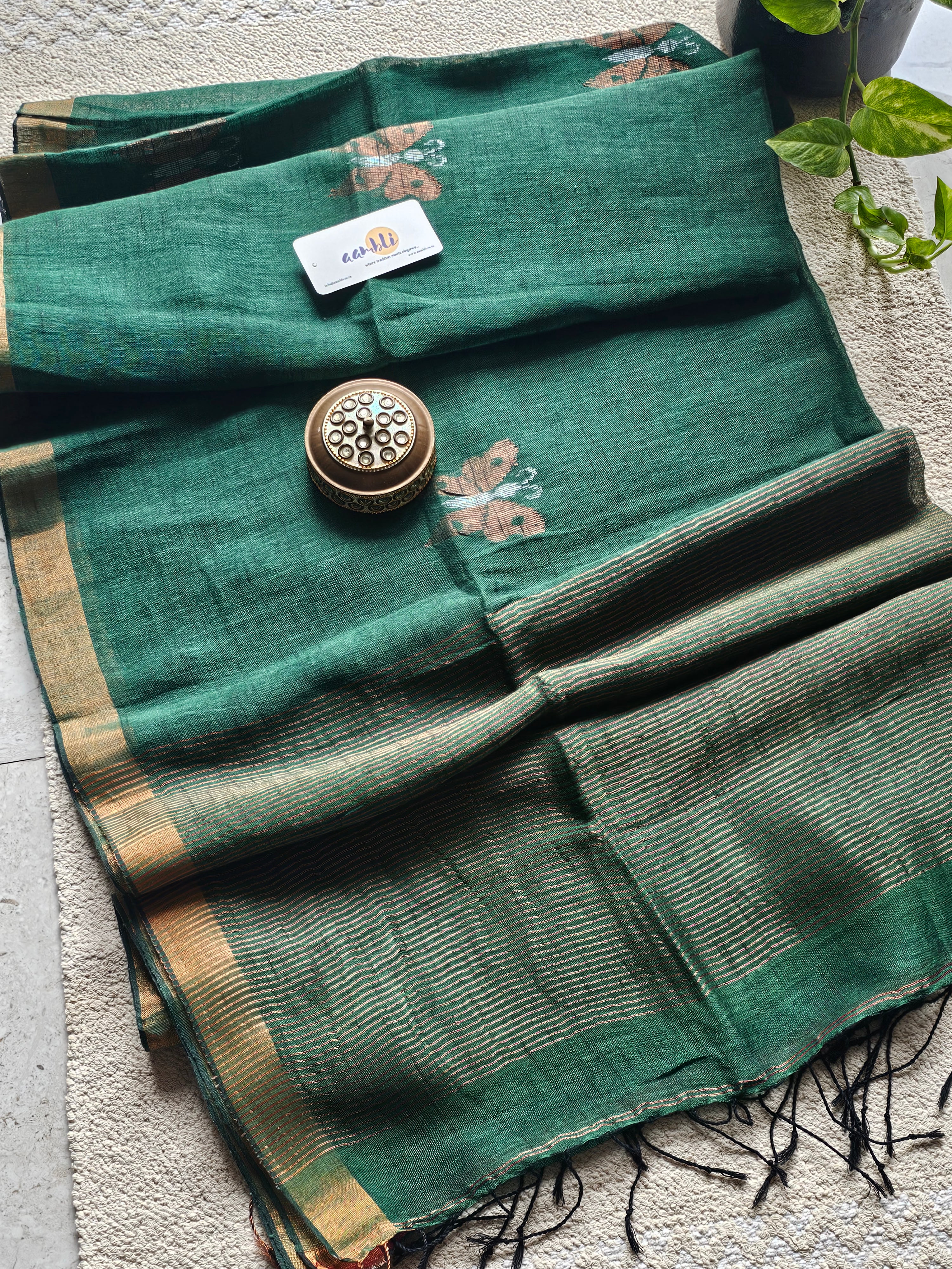 Green pure handwoven linen saree with zari butterfly design