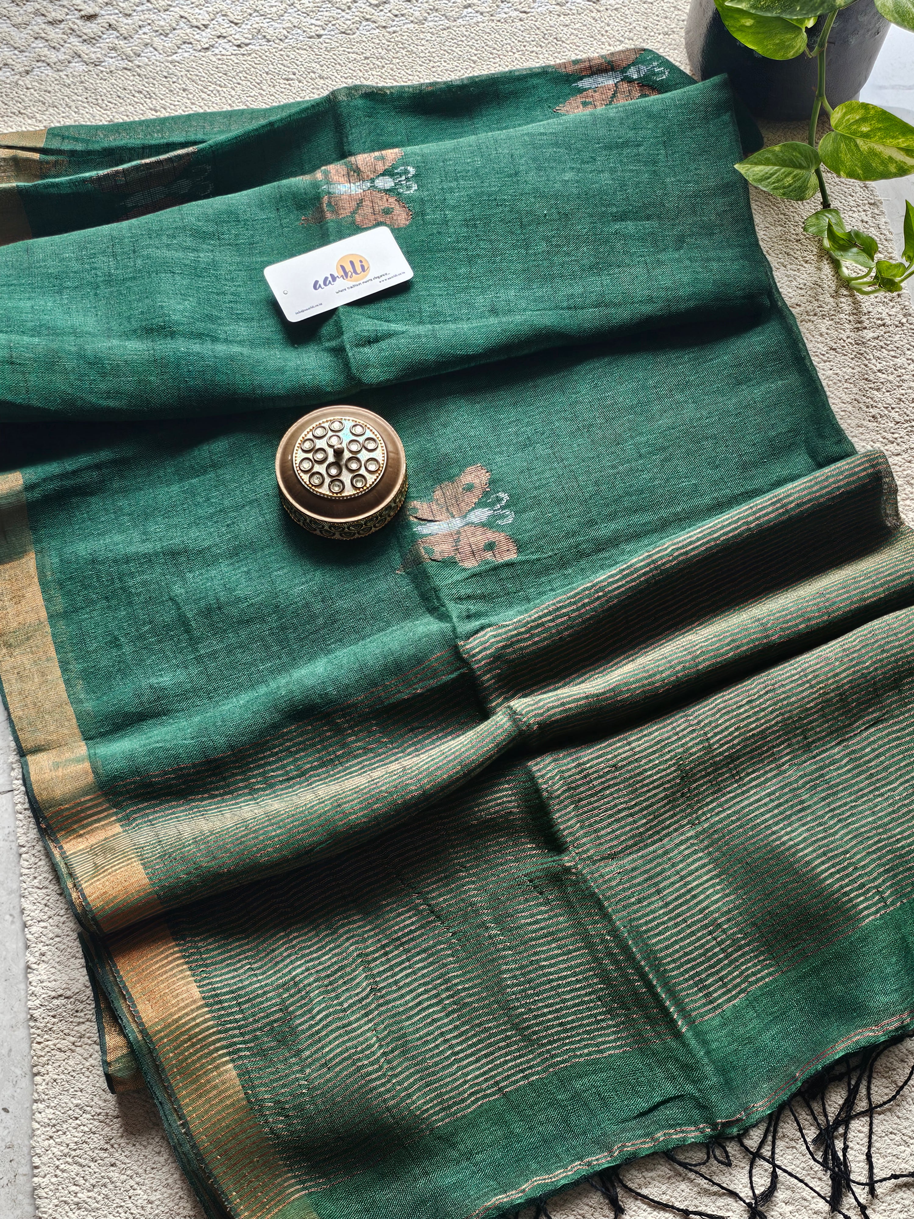 Green pure handwoven linen saree with zari butterfly design