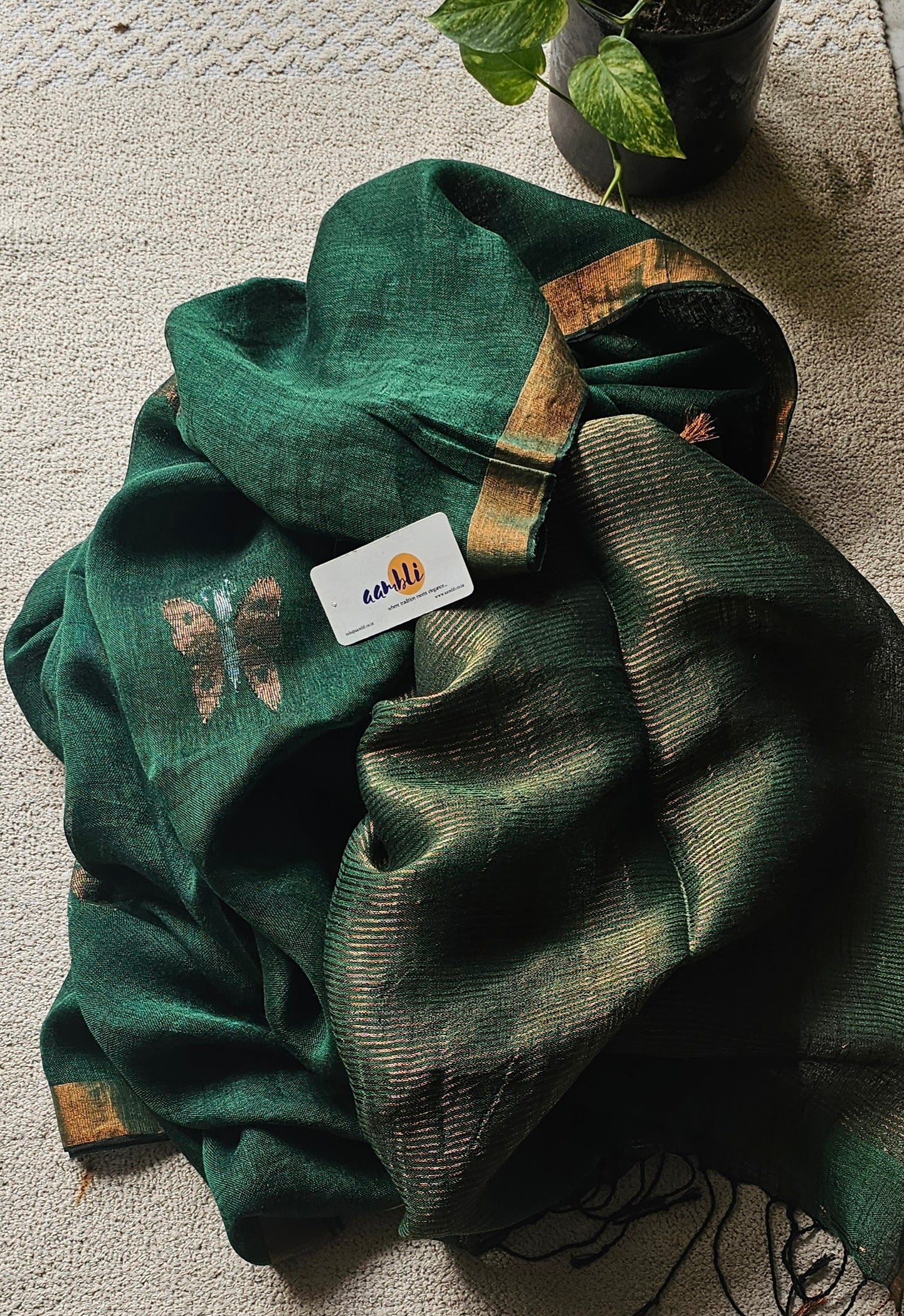 Green pure handwoven linen saree with zari butterfly design