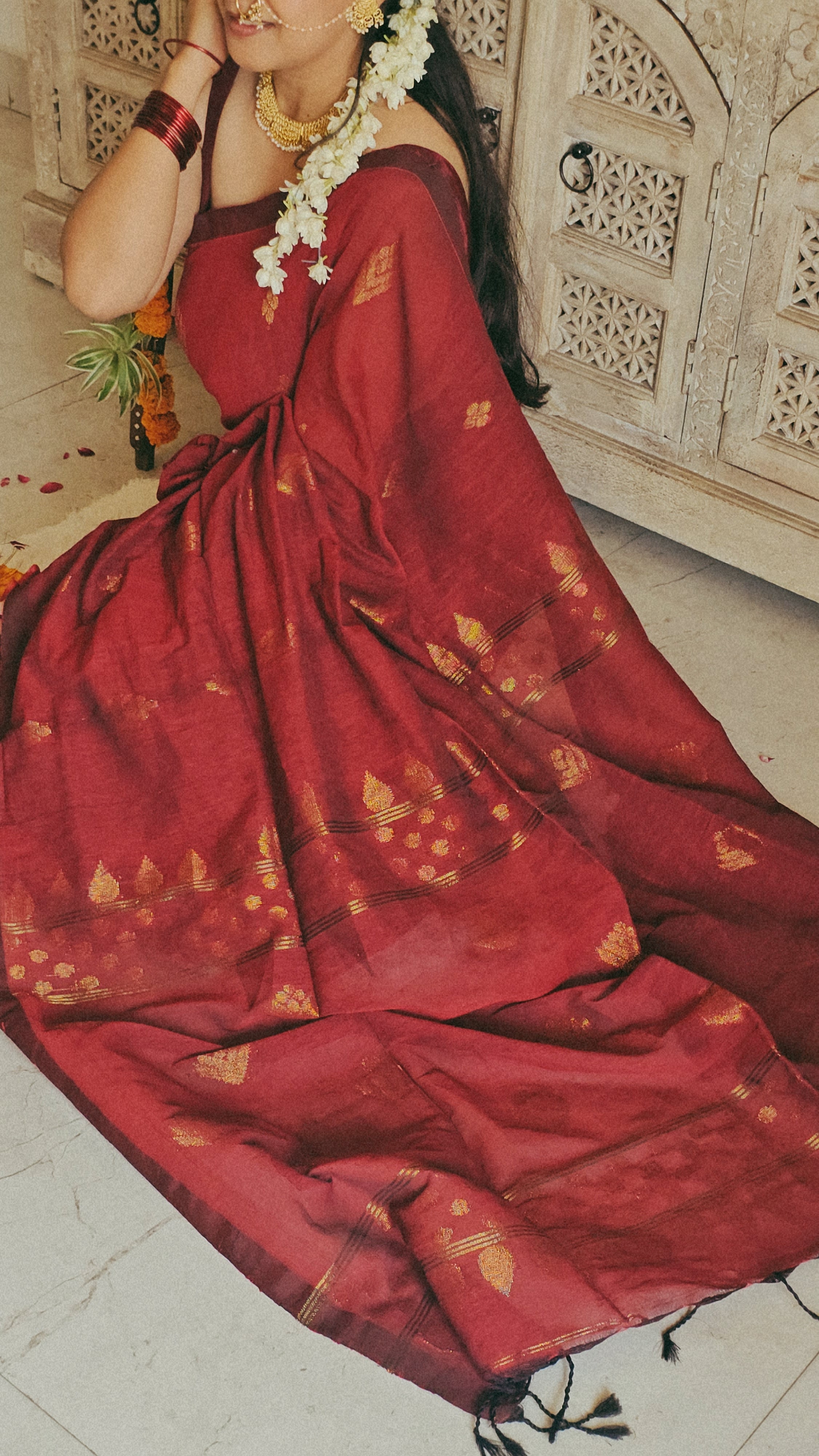 Maroon pure handwoven linen saree with zari booti design