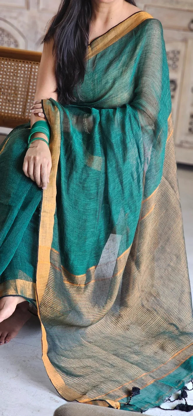 Green Pure Handwoven Linen saree with Zari strips