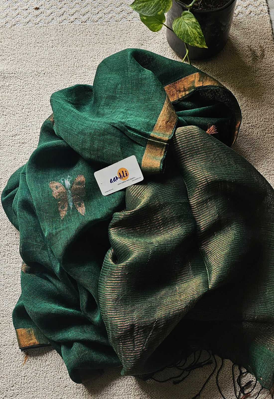 Green pure handwoven linen saree with zari butterfly design